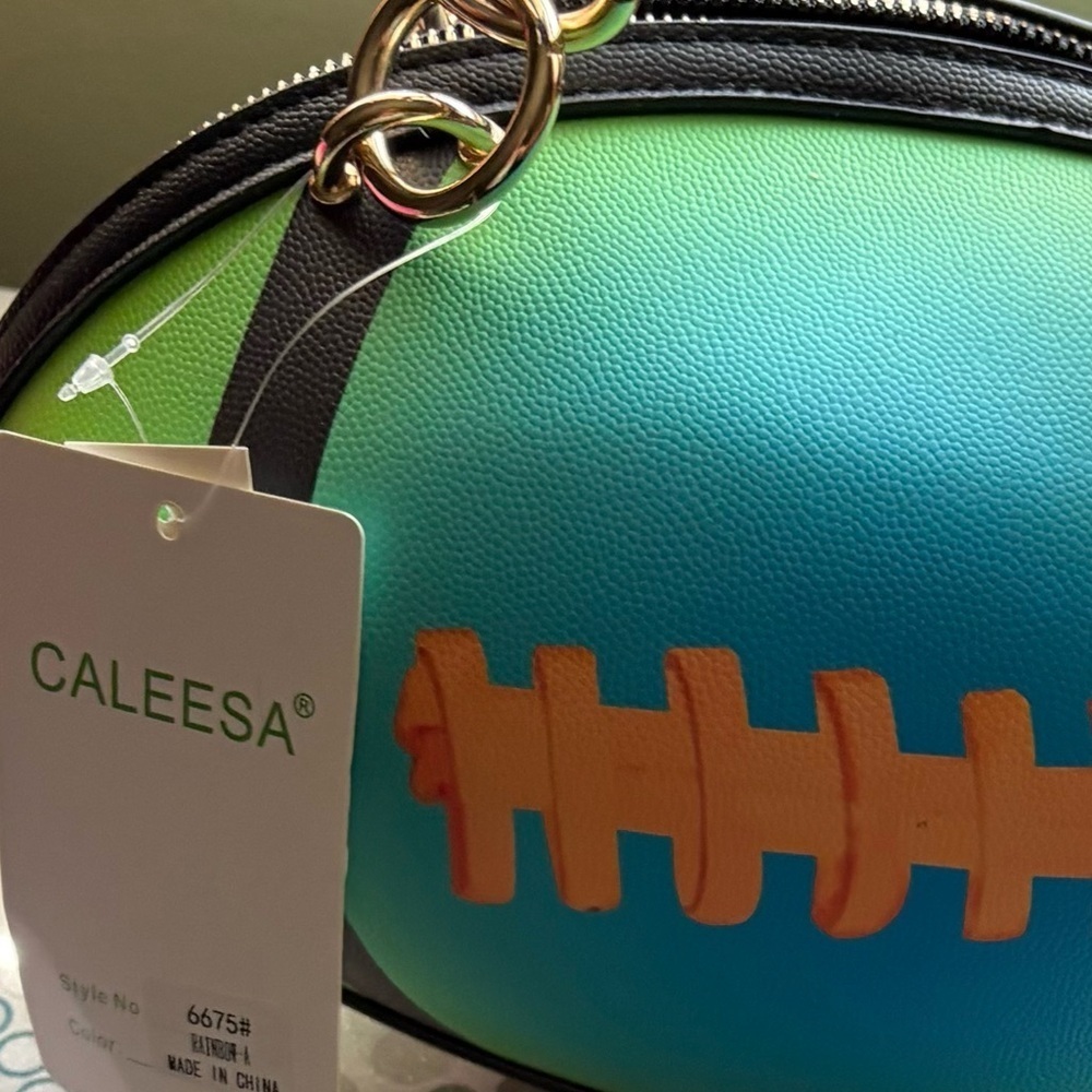 NWT-Rugby Teal & Lime
Whimsical Festival pebble textured football handbag - Picture 10 of 10